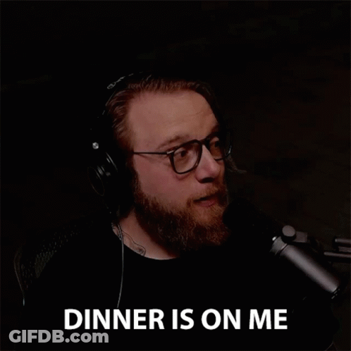 Bearded Man In Headphones And Glasses Says Dinner Is On Me GIF