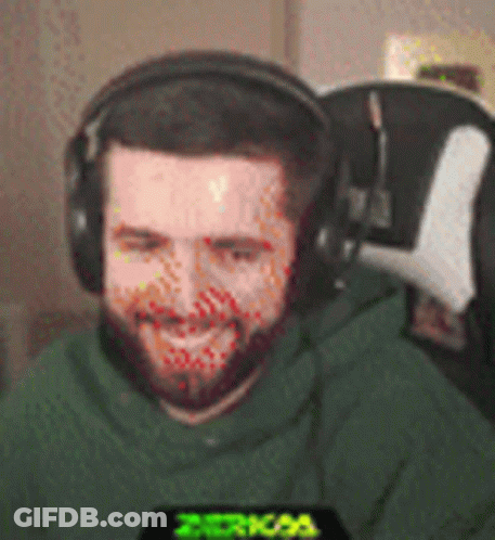 Bearded Man In Headphones And Green Hoodie Smiling GIF