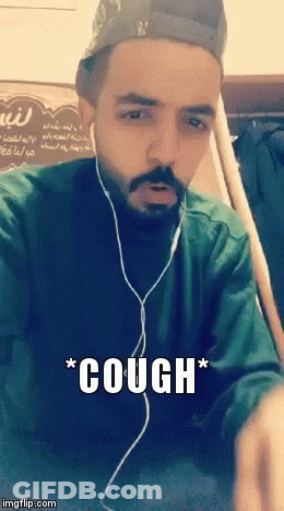 Bearded Man In Headphones And Hat Coughs GIF