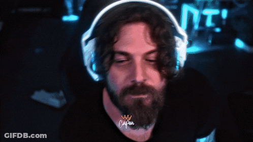 Bearded Man In Headphones With Crown Shirt GIF