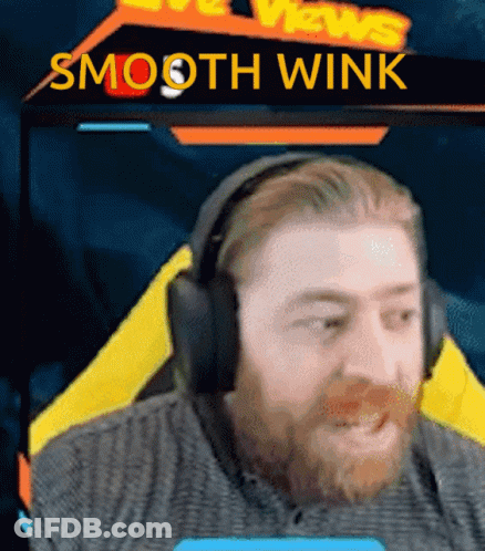 Bearded Man In Headphones With Smooth Wink Sign GIF