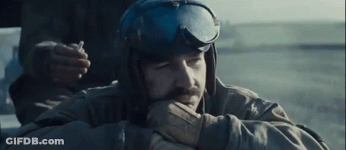 Bearded Man In Helmet And Goggles Smoking Cigarette GIF