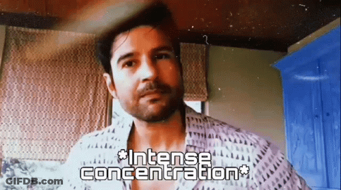 Bearded Man In Intense Concentration At Window GIF
