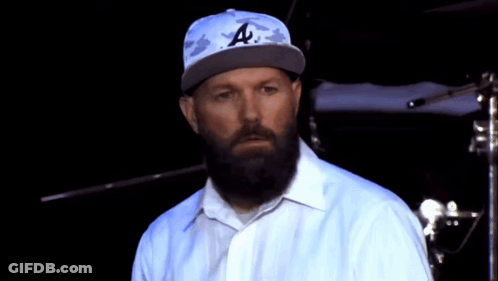 Bearded Man In LA Hat And White Shirt GIF
