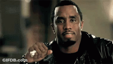 Bearded Man In Leather Jacket Holding Ring GIF