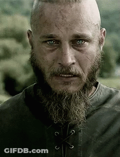 Bearded Man In Leather Jacket Looking At Camera GIF