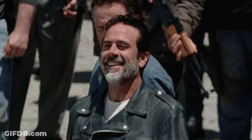 Bearded Man In Leather Jacket Smiling In Crowd GIF