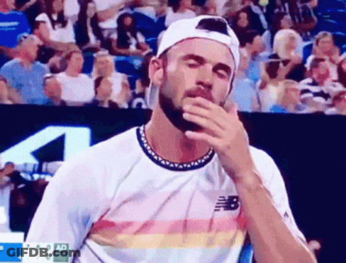 Bearded Man In New Balance Shirt Wiping Face GIF