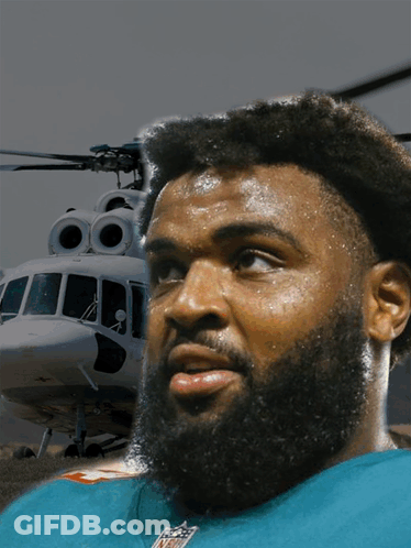 Bearded Man In NFL Shirt In Front Of Helicopter GIF