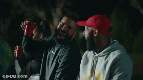 Bearded Man In Nike Jacket Laughing With Another Man GIF