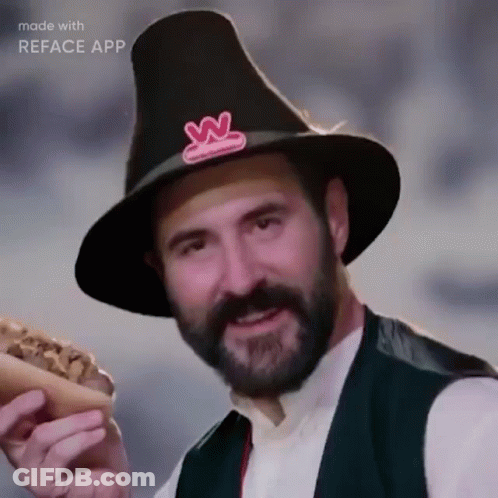 Bearded Man In Pilgrim Hat Holding Hot Dog GIF
