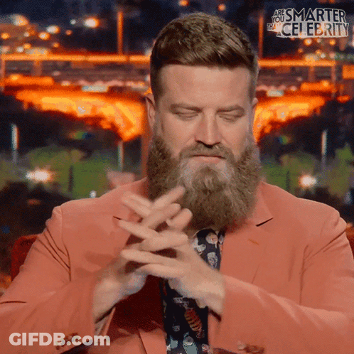 Bearded Man In Pink Suit And Tie GIF
