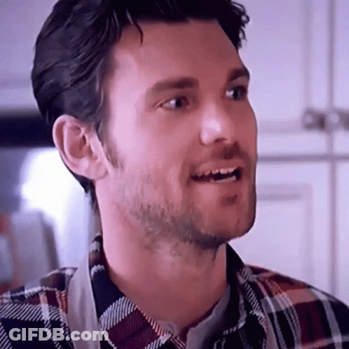 Bearded Man In Plaid Shirt And Apron Smiling GIF