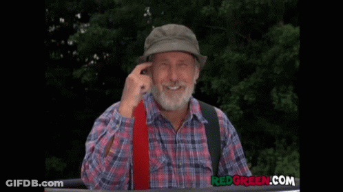 Bearded Man In Plaid Shirt And Hat With Redgreen.com Logo GIF