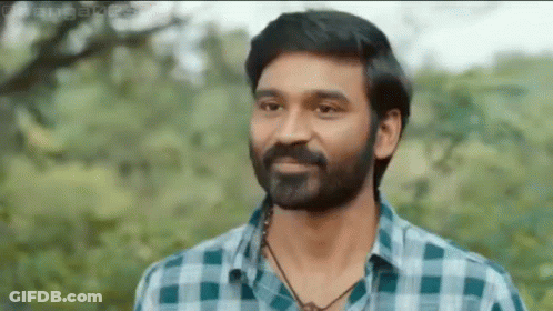 Bearded Man In Plaid Shirt And Necklace GIF