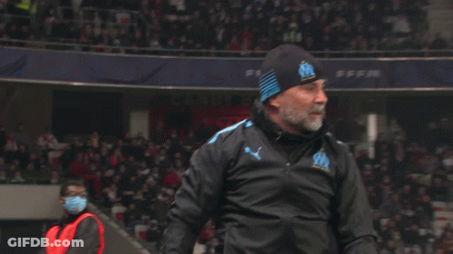Bearded Man In Puma Jacket And Beanie With Letter O GIF