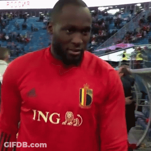 Bearded Man In Red Adidas Shirt At Stadium GIF