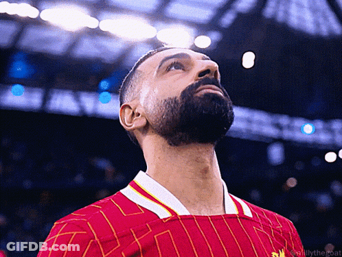 Bearded Man In Red And Yellow Striped Shirt Looking Up GIF