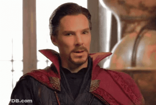 Bearded Man In Red Cape And Black Jacket GIF