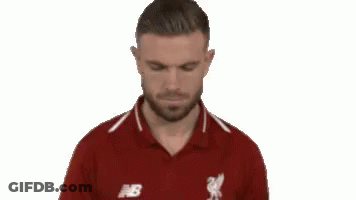 Bearded Man In Red Polo Looking Down GIF