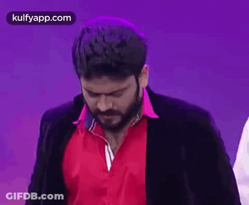 Bearded Man In Red Shirt And Black Jacket Making Funny Face GIF