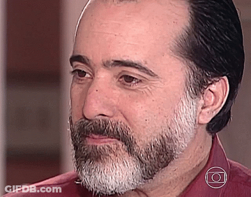 Bearded Man In Red Shirt And Circle Necklace GIF