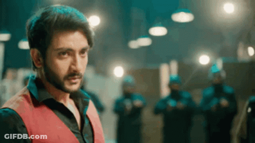 Bearded Man In Red Vest Before Police GIF