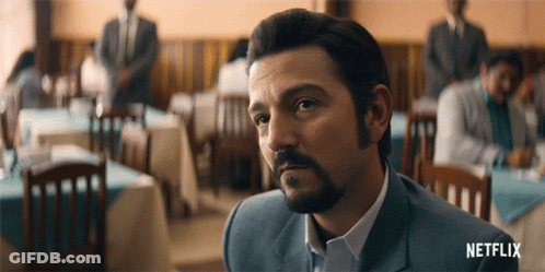 Bearded Man In Restaurant With Netflix Logo GIF