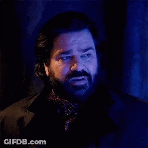 Bearded Man In Scarf With Blue Light GIF
