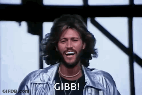 Bearded Man In Silver Jacket Laughing GIF