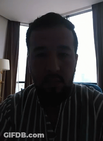 Bearded Man In Striped Shirt GIF