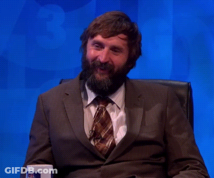 Bearded Man In Suit And Tie Hands In Air GIF