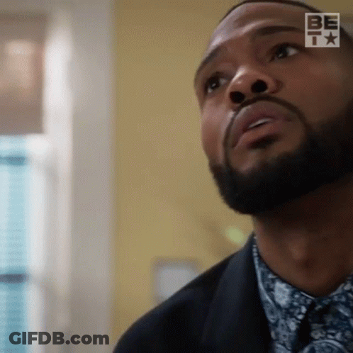 Bearded Man In Suit And Tie Looking Up GIF