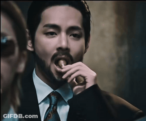 Bearded Man In Suit Eating Food GIF