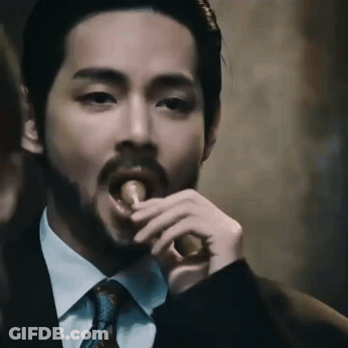 Bearded Man In Suit Eating Meat GIF