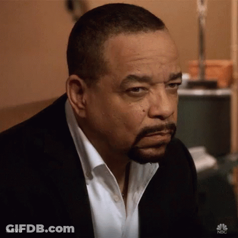 Bearded Man In Suit Looking At Camera GIF