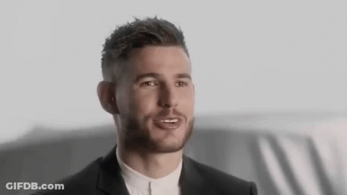 Bearded Man In Suit Talking To Someone GIF