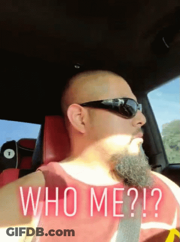 Bearded Man In Sunglasses And Red Tank Top Saying Who Me GIF