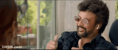 Bearded Man In Sunglasses Thumbs Up To Woman GIF