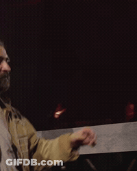 Bearded Man In Tan Jacket And White T-Shirt GIF