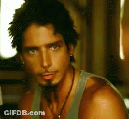 Bearded Man In Tank Top With Earrings GIF