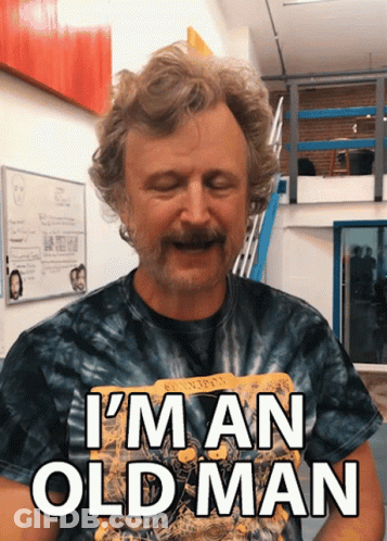 Bearded Man In Tie Dye Shirt Saying I'm An Old Man GIF