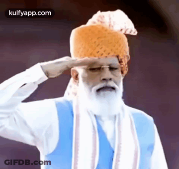 Bearded Man In Turban And Blue Vest Saluting GIF