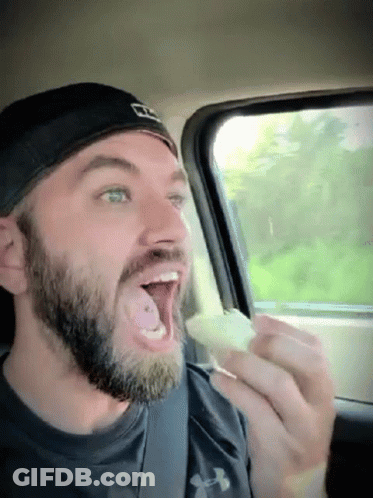 Bearded Man In Under Armour Shirt Eating GIF