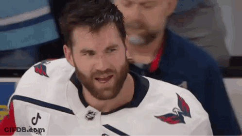 Bearded Man In White Hockey Jersey Smiling GIF