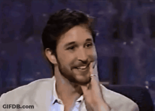 Bearded Man In White Jacket Smiling GIF