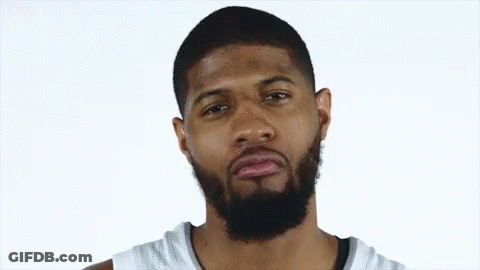 Bearded Man In White Jersey Looks At Camera GIF