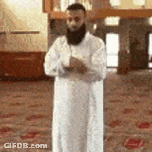 Bearded Man In White Robe Praying At Mosque GIF