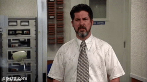 Bearded Man In White Shirt And Tie In Hallway GIF