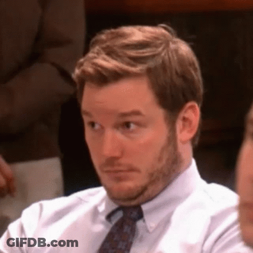 Bearded Man In White Shirt And Tie Looking GIF